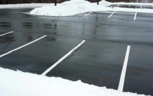 Parking lot after snow plow removal cleaning