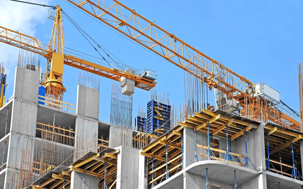 Construction site progress with large cranes
