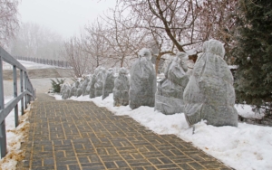 Protection of bushes from frost along the stairs in the winter park