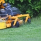 Image of a professional mower on the grass.
