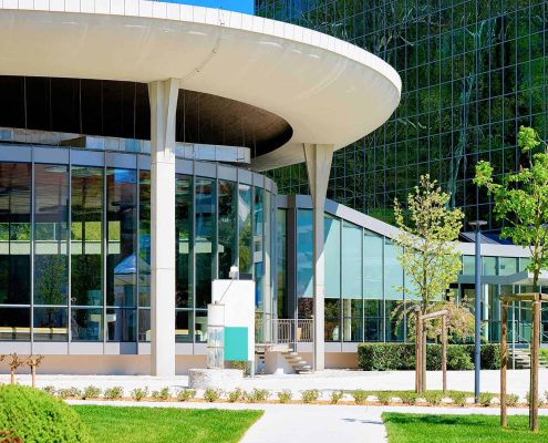 Front View Of A Modern Medical Center With Landscaping
