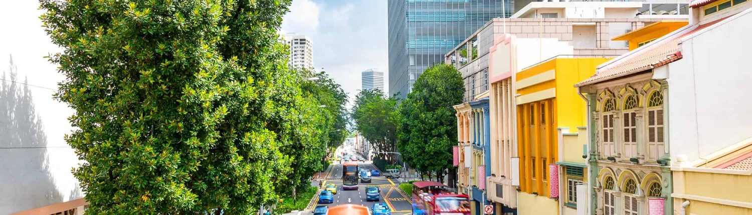 Front-view-of-traffic-on-Singapore-city-street Front View Of Traffic On Singapore City Street