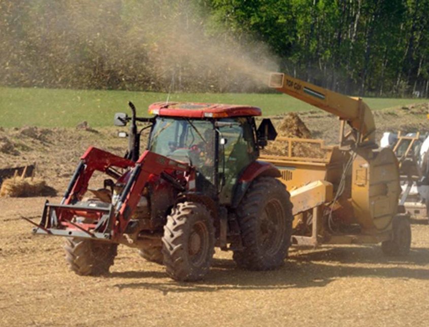 Mulching Machine Spitting Mulch Out Over A Field 1030x644