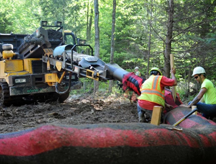 Varsity Workers Creating An Erosion Control Barrier 1030x644