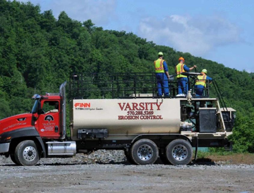 Varsity Workers On A Vehicle 1030x644