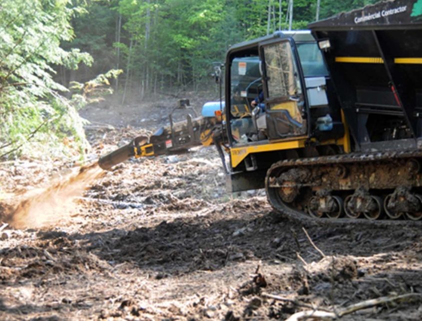 Varsity Workers Using A Mulch Spraying Machine 1030x644